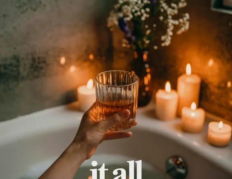 Aesthetic bathtub photography edit: moody candlelight scene with crystal glass