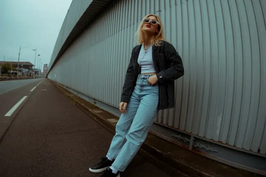 Moody Urban Street Style Outfit with Striped Jacket and Light Blue Jeans